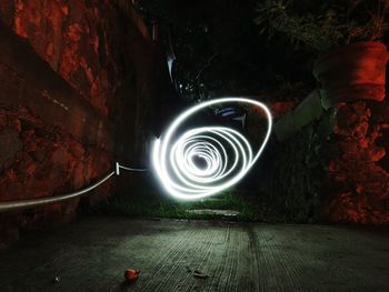 Illuminated light by water at night