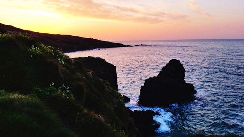 Scenic view of sea at sunset