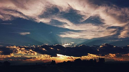 Scenic view of landscape against cloudy sky