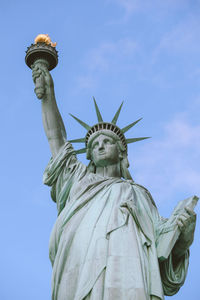 Low angle view of statue against sky