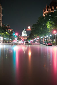 Illuminated buildings in city at night