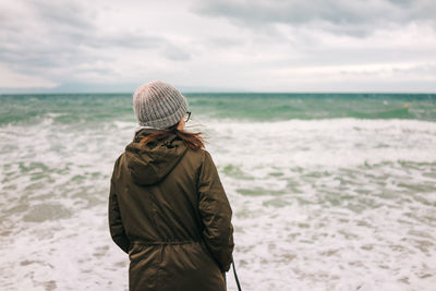 Rear view of woman looking at sea