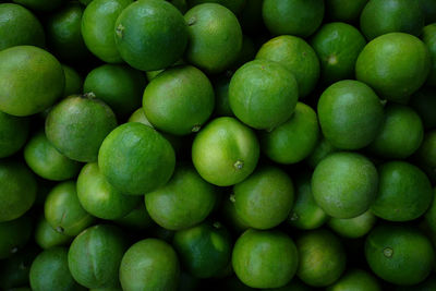 Full frame shot of limes for sale at market