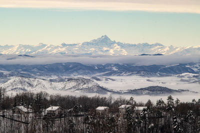 Scenic view of snowcapped mountains against sky