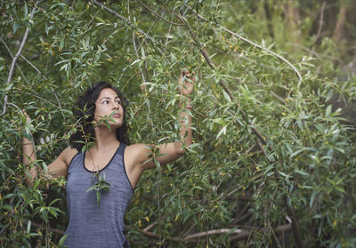 Woman among the vegetation of a river. person