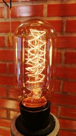 Close-up of illuminated light bulb