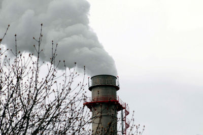 Smoke coming out of an industrial chimney, pollutant emissions in the industry