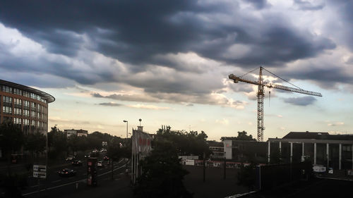 City street against cloudy sky