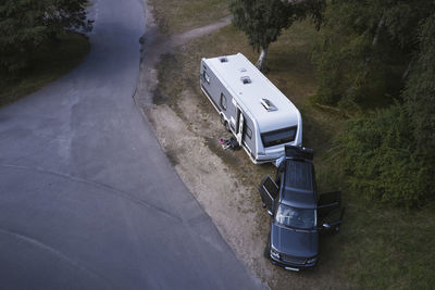 High angle view of car with camper van