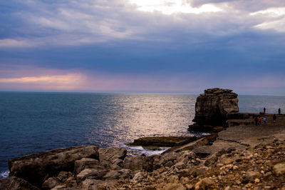 Scenic view of sea against cloudy sky