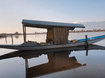 Pier over lake against sky