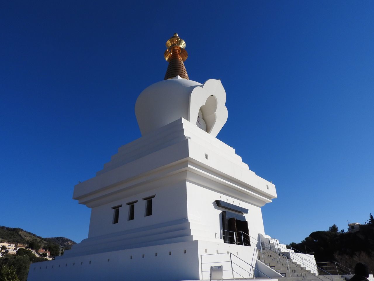 religion, spirituality, low angle view, place of worship, architecture, clear sky, no people, outdoors, sky, pilgrimage, statue, illuminated, day