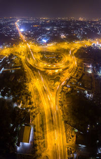 Aerial view of illuminated city at night