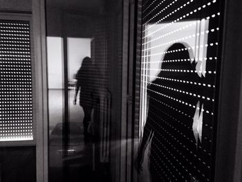 Woman standing on escalator