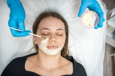 High angle view of young woman with face