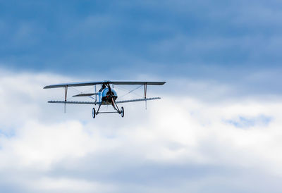 Low angle view of airplane against sky