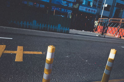 High angle view of arrow sign on road in city