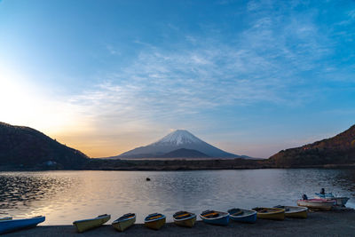 Mount fuji. view at lake shoji or shojiko  in the morning day with row of boats. yamanashi, japan.