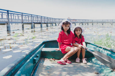 Two cute little girls standing in bridge