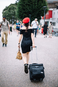 Rear view of people on road