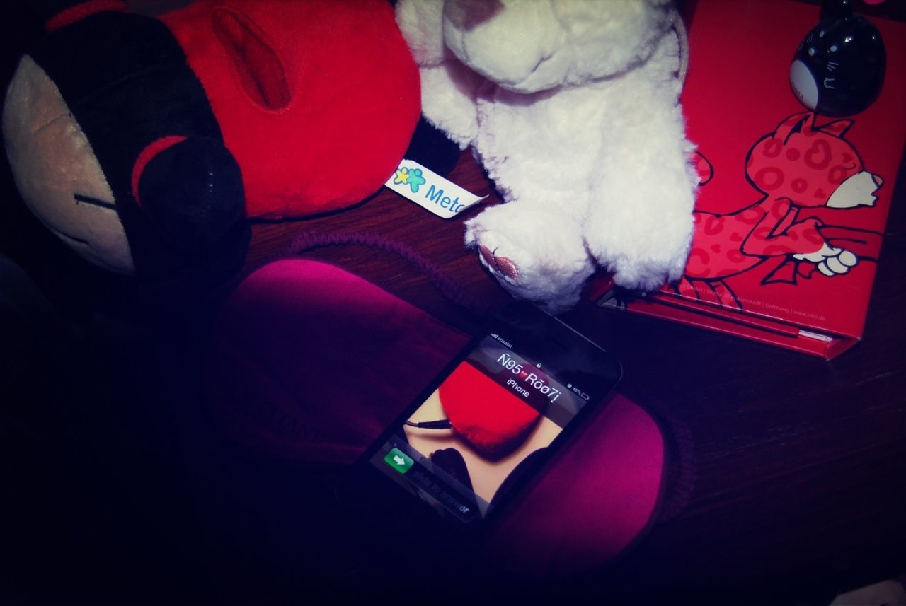 indoors, table, still life, high angle view, home interior, red, no people, book, close-up, bed, sofa, relaxation, white color, paper, chair, toy, absence, home, pen, cushion