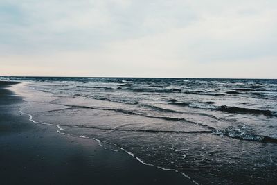 Scenic view of calm sea against sky