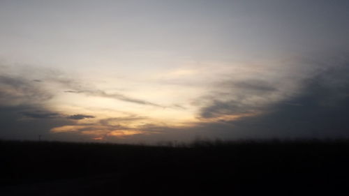 Silhouette landscape against sky during sunset