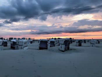 Scenic view of beach against sky during sunset