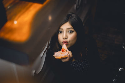 Portrait of woman holding ice cream