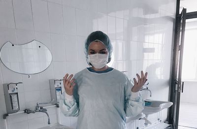 Portrait of person working in bathroom