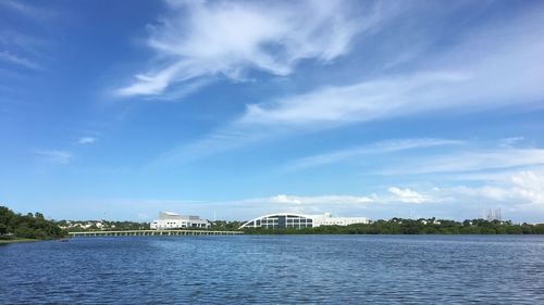 Scenic view of river against blue sky