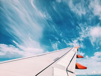 Low angle view of airplane flying in sky