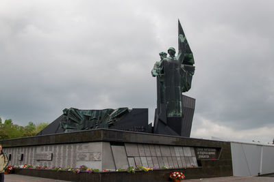 Low angle view of statue against building