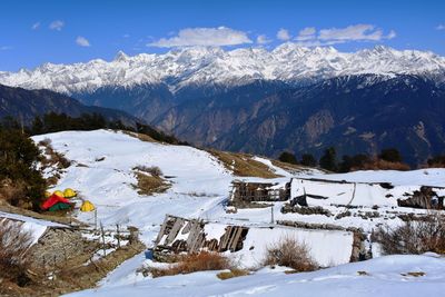 Scenic view of snowcapped mountains against sky