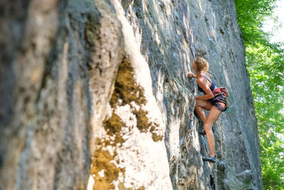 Full length of shirtless man on rock