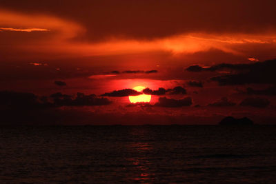 Scenic view of sea against romantic sky at sunset