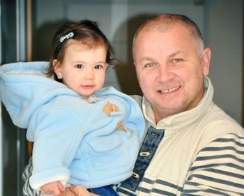 Portrait of smiling father with daughter