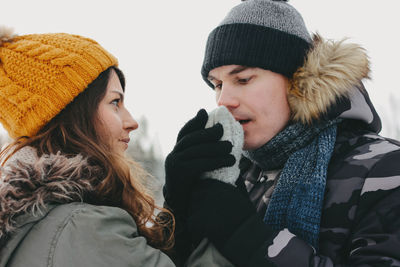 Close-up of couple in warm clothes during winter