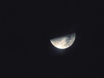 Low angle view of moon against clear sky at night