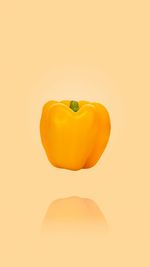 Close-up of orange bell pepper against white background