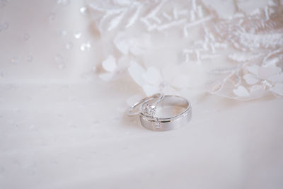 High angle view of wedding rings on table