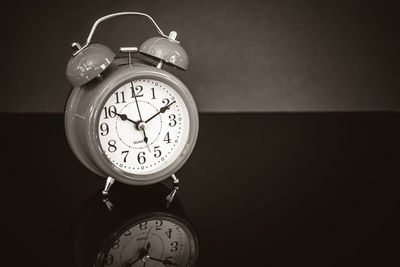 Close-up of alarm clock on table