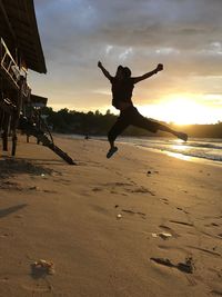 Man jumping on beach