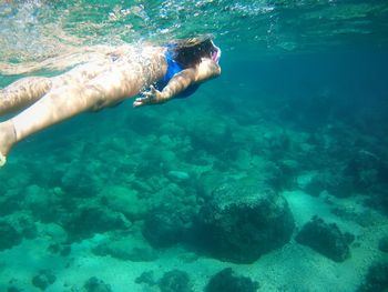 Woman swimming in sea