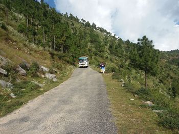 Cars on road against sky