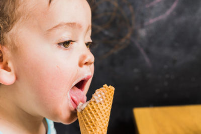 Close-up of girl eating ice cream