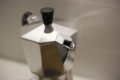 Close-up of coffee maker on table