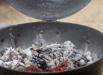 High angle view of meat on barbecue grill