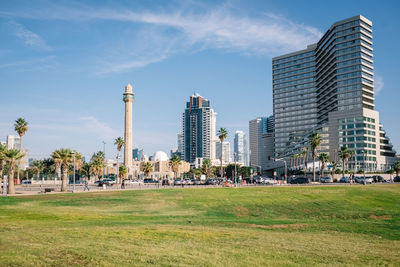 Modern buildings in city against sky