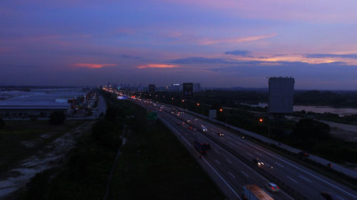 Aerial view of road passing through city